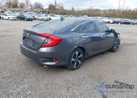 2017 Honda Civic Touring z USA, uszkodzony, nr VIN 2HGFC1F97HH654564